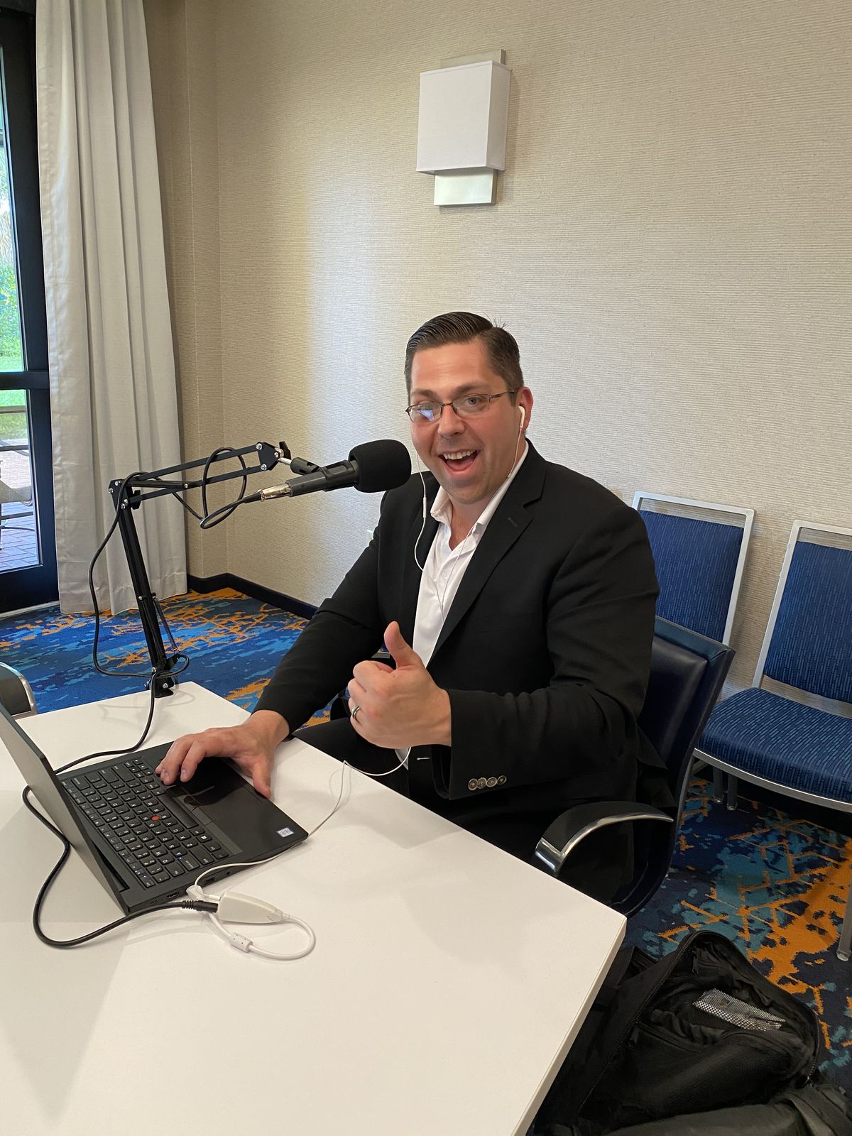 Joe Malmuth recording a podcast episode
